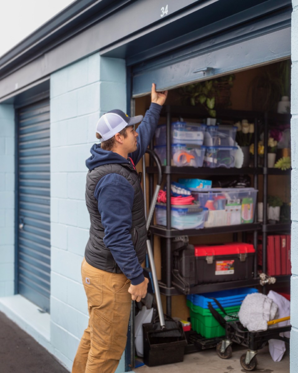 Person opening a storage unit door